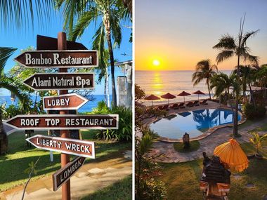 Directional signs to local attractions next to a tropical pool area at sunrise, with palm trees and ocean view.